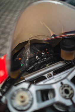 Motorcycle's tachometer and dashboard, focusing on its illuminated display and controls, viewed through the windshield, representing technology, mechanics, and speed in a well-crafted design clipart