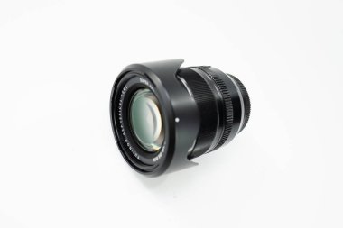 Detailed view of a professional high-quality digital camera lens featuring precise focus and sleek black design, enhancing photography capabilities. clipart