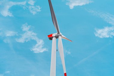 Rotor Blades of a Energy Producing Wind Turbine are Checked by an Technician to Inspect the Modern Power Generator for Potential Damage, Corrosion, Cleaning clipart