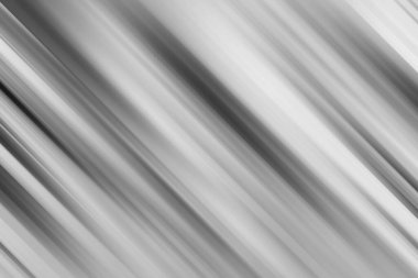 Çeşitli yaratıcı projeler ve görsel göstergeler için parlak ve çağdaş bir estetik sunan, gri tonlarda köşegen çizgileri olan büyüleyici bir hareket bulanık arka plan.