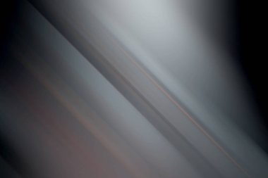 Pürüzsüz, soyut bir arkaplan, köşegen hareket bulanıklığı, hoş griler ve ince renk aksanları, çeşitli tasarım uygulamaları için modern ve rafine bir estetik sağlıyor..
