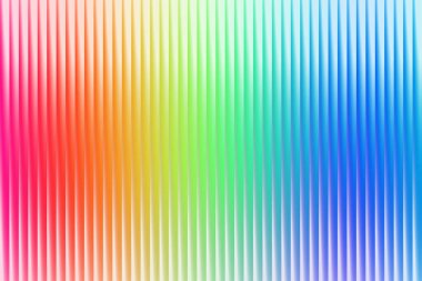 Tam spektrumlu gökkuşağı gradyanı ile aydınlatılmış dikey tırtıklı dokuya sahip dinamik soyut bir arkaplan. Pürüzsüz renk geçişleri bir hareket ve neşe hissi yaratır..
