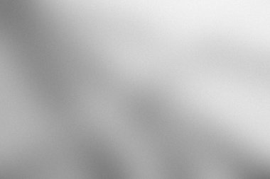This monochrome grainy gradient background features blurred gray and white tones, creating a subtle and textured surface ideal for modern designs and artistic use.