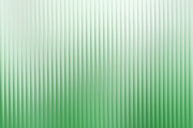 Dikey çizgileri olan bu canlı yeşil gradyan, herhangi bir tasarım projesine derinlik ve doğa dokunuşu eklemek için ideal, görsel olarak çekici bir doku sunar..