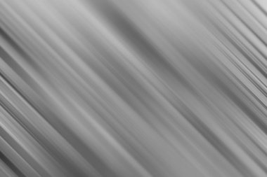 Çeşitli yaratıcı tasarımlar için görsel olarak çekici ve çok yönlü bir zemin oluşturan, gümüş ve gri tonların parlak bir kombinasyonuna sahip modern soyut bir arka plan.