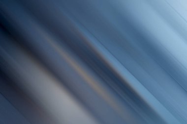 Çapraz çizgiler ve bulanık bir efekt içeren büyüleyici bir soyut arkaplan tasarım ve sunumlara modern zarafet katmak için idealdir. Serin tonları sakinliği çağrıştırıyor..