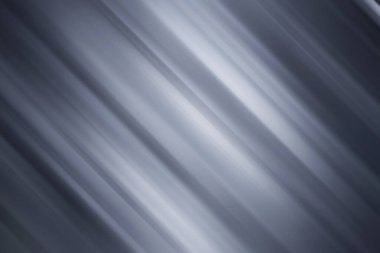 Bulanık gri ve gümüşten oluşan köşegen çizgileri olan sofistike, soyut bir arka plan. Parlak, metalik bir hareket ve incelik hissi uyandırıyor..