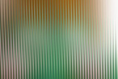 Enerjik, soyut bir arka plan dikey, tırtıklı bir dokuyu sergiliyor, yemyeşil tonları ılık turuncu tonlarla harmanlıyor, dinamik ve doğal bir görsel cazibe sunuyor..