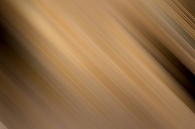 Zengin kahverengi ve altın tonlarda, soyut, köşegen hareket bulanıklığı. Lüks ve sofistike, zarif ve kaliteli tasarım uygulamaları için mükemmel..