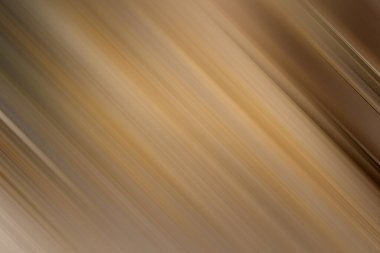 Çapraz hareket bulanıklığına sahip soyut bir arkaplan, doğal bir zarafet ve akış duygusunu çağrıştıran bej, kahverengi ve altın tonlarını içeren bir palet..