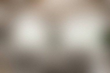 Yumuşak, dağınık ışıklandırmalı ince bir doku nötr, metalik bir yüzey üzerinde parlak ışıklar yaratıyor, minimalist tasarımlar için mükemmel..