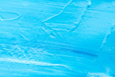 Yağlı boyalı mavi bir arka plan. Soyut akrilik boya dokusu. Güzel fırça darbeleri yakın çekim