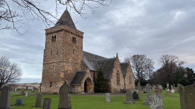 Scotland - December 26th 2024: Aberlady Parish Church in Scotland. Historic stone church in a medieval design clipart