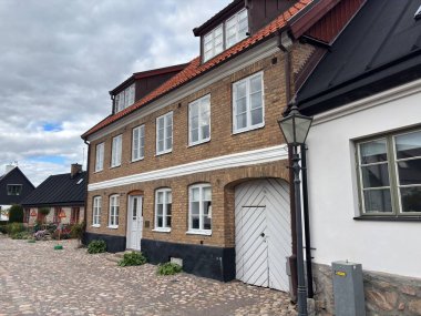 Scenic Raa Sweden locality featuring historic 19th-century fishing port marina pebbled shoreline dunes and traditional wooden architecture near Helsingborg. R