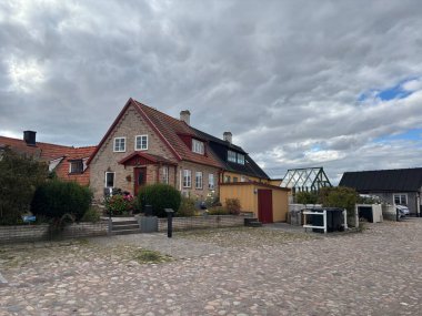 Scenic Raa Sweden locality featuring historic 19th-century fishing port marina pebbled shoreline dunes and traditional wooden architecture near Helsingborg. R