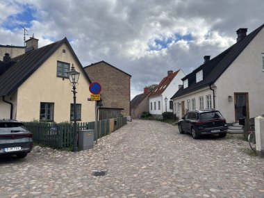 Scenic Raa Sweden locality featuring historic 19th-century fishing port marina pebbled shoreline dunes and traditional wooden architecture near Helsingborg. R
