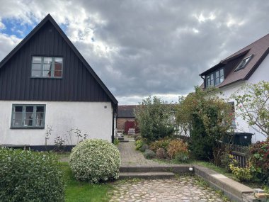Scenic Raa Sweden locality featuring historic 19th-century fishing port marina pebbled shoreline dunes and traditional wooden architecture near Helsingborg. R