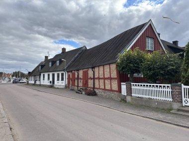 Scenic Raa Sweden locality featuring historic 19th-century fishing port marina pebbled shoreline dunes and traditional wooden architecture near Helsingborg. R