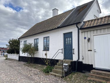 Scenic Raa Sweden locality featuring historic 19th-century fishing port marina pebbled shoreline dunes and traditional wooden architecture near Helsingborg. R