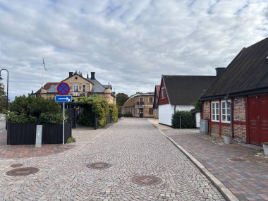 Scenic Raa Sweden locality featuring historic 19th-century fishing port marina pebbled shoreline dunes and traditional wooden architecture near Helsingborg. R