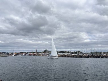 Scenic Raa Sweden locality featuring historic 19th-century fishing port marina pebbled shoreline dunes and traditional wooden architecture near Helsingborg. R
