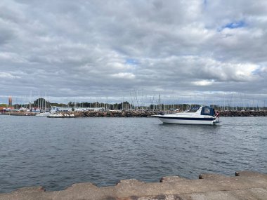 Scenic Raa Sweden locality featuring historic 19th-century fishing port marina pebbled shoreline dunes and traditional wooden architecture near Helsingborg. R