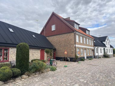 Scenic Raa Sweden locality featuring historic 19th-century fishing port marina pebbled shoreline dunes and traditional wooden architecture near Helsingborg. R