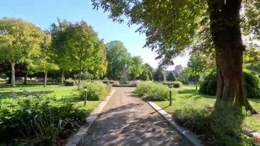 Views of Landskrona Sweden city centre with park amid pedestrian streets and plaza areas.