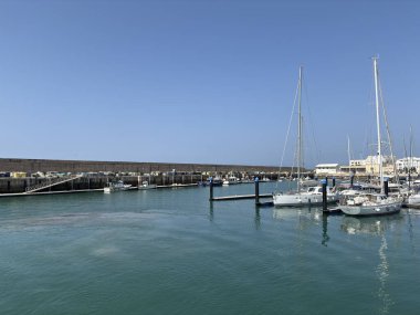 Bay of Cadiz catamaran ferry service in Spain connecting Cadiz port to El Puerto de Santa Maria and Rota featuring onboard deck perspectives harbor skyline and expansive Atlantic sea passages.