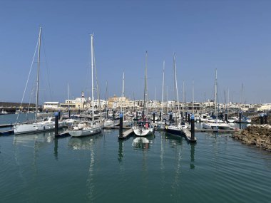 Bay of Cadiz catamaran ferry service in Spain connecting Cadiz port to El Puerto de Santa Maria and Rota featuring onboard deck perspectives harbor skyline and expansive Atlantic sea passages.