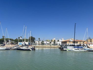 Bay of Cadiz catamaran ferry service in Spain connecting Cadiz port to El Puerto de Santa Maria and Rota featuring onboard deck perspectives harbor skyline and expansive Atlantic sea passages.