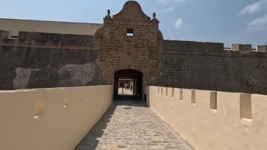 View of Castillo de Santa Catalina in Cadiz Spain built 1598-1621 featuring Italian-style star plan chapel of Santa Catalina and panoramic sea views from rocky promontory near city centre.