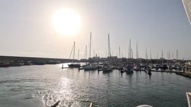 Bay of Cadiz catamaran ferry service in Spain connecting Cadiz port to El Puerto de Santa Maria and Rota featuring onboard deck perspectives harbor skyline and expansive Atlantic sea passages.