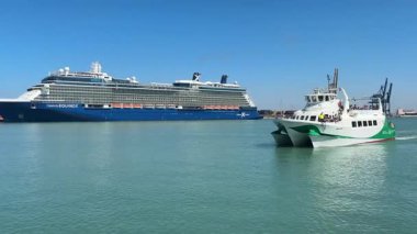 Bay of Cadiz catamaran ferry service in Spain connecting Cadiz port to El Puerto de Santa Maria and Rota featuring onboard deck perspectives harbor skyline and expansive Atlantic sea passages.