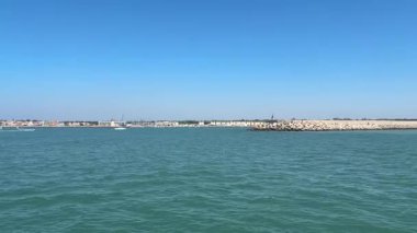 Bay of Cadiz catamaran ferry service in Spain connecting Cadiz port to El Puerto de Santa Maria and Rota featuring onboard deck perspectives harbor skyline and expansive Atlantic sea passages.