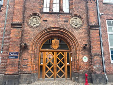 Views of Helsingr Denmark city centre architecture such as half-timbered houses on Stengade and dock scenes at Helsingr Havn with ferries to Sweden and maritime structures in resund setting.