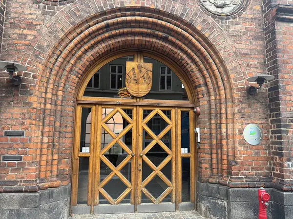 Views of Helsingr Denmark city centre architecture such as half-timbered houses on Stengade and dock scenes at Helsingr Havn with ferries to Sweden and maritime structures in resund setting.