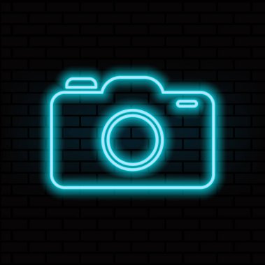 Parlayan neon hat kamera ikonu tuğla duvar arka planında izole edildi. Fotoğraf makinesi simgesi. Vektör. 3.eps.4