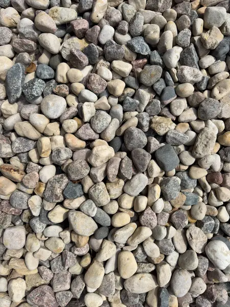 Yerde çakıl, granit ve çakıl taşları var. Granit desenli. Yüksek kalite fotoğraf