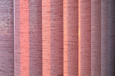 pink vertical blinds with texture, light passing through creates sharp shadows and geometric lines. clipart