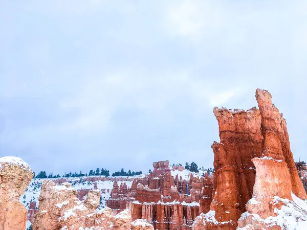 stock image Snow scene colorful cliffs with  red rock and stone in Bryce Canyon National Park