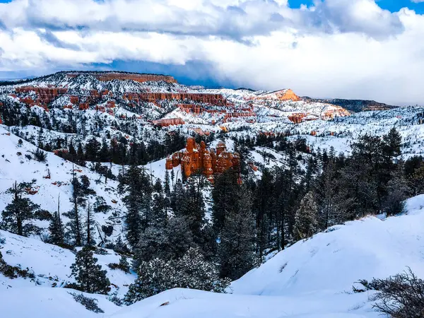 stock image Snow scene colorful cliffs with red rock and stone in Bryce Canyon National Park