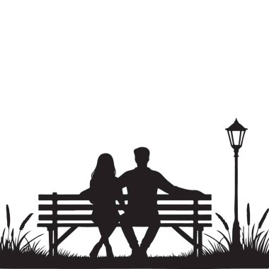 Park 'ta sokak lambasının altında oturan bir çiftin silueti.