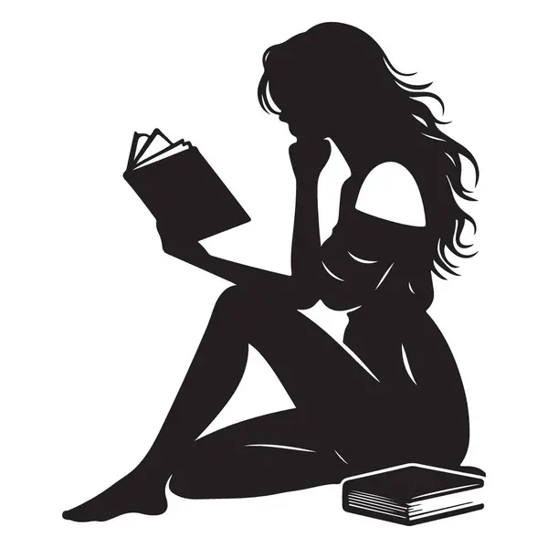 Yerde oturan ve kitap okuyan bir kadının silueti.