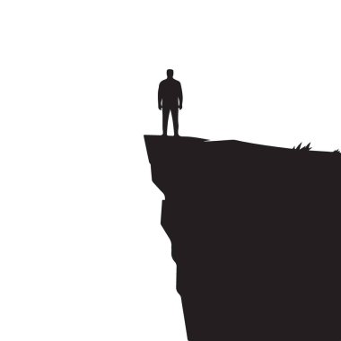 Uçurumun kenarında duran bir adamın silueti