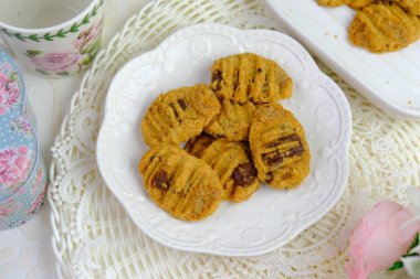 Popular cookies in Malaysia during celebration of Eid Mubarak (Hari Raya) on white isolated background. pineapple tart, chocolate chips, jam cookies, layer cake legit clipart