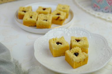 Popular cookies in Malaysia during celebration of Eid Mubarak (Hari Raya) on white isolated background. pineapple tart, chocolate chips, jam cookies, layer cake legit clipart