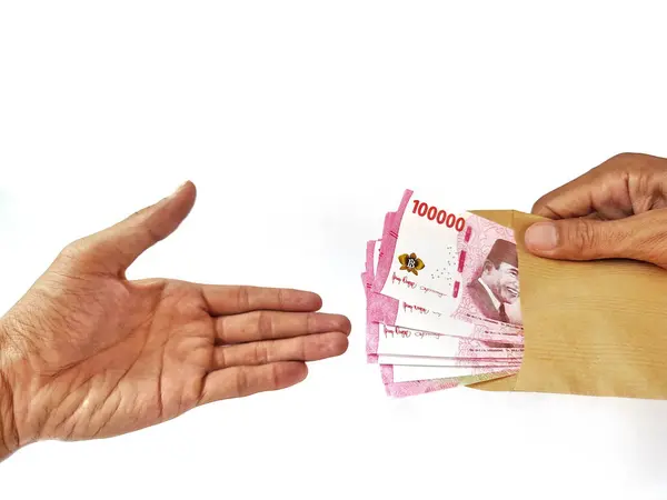 stock image hand with banknotes and money on white background