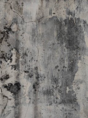 Çatlakları ve çizikleri olan metal bir duvarın dokusu arka plan olarak kullanılabilir.