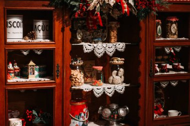 Grandmas old shelf adorned with sweets and beautiful jars, evoking a charming, nostalgic ambiance clipart